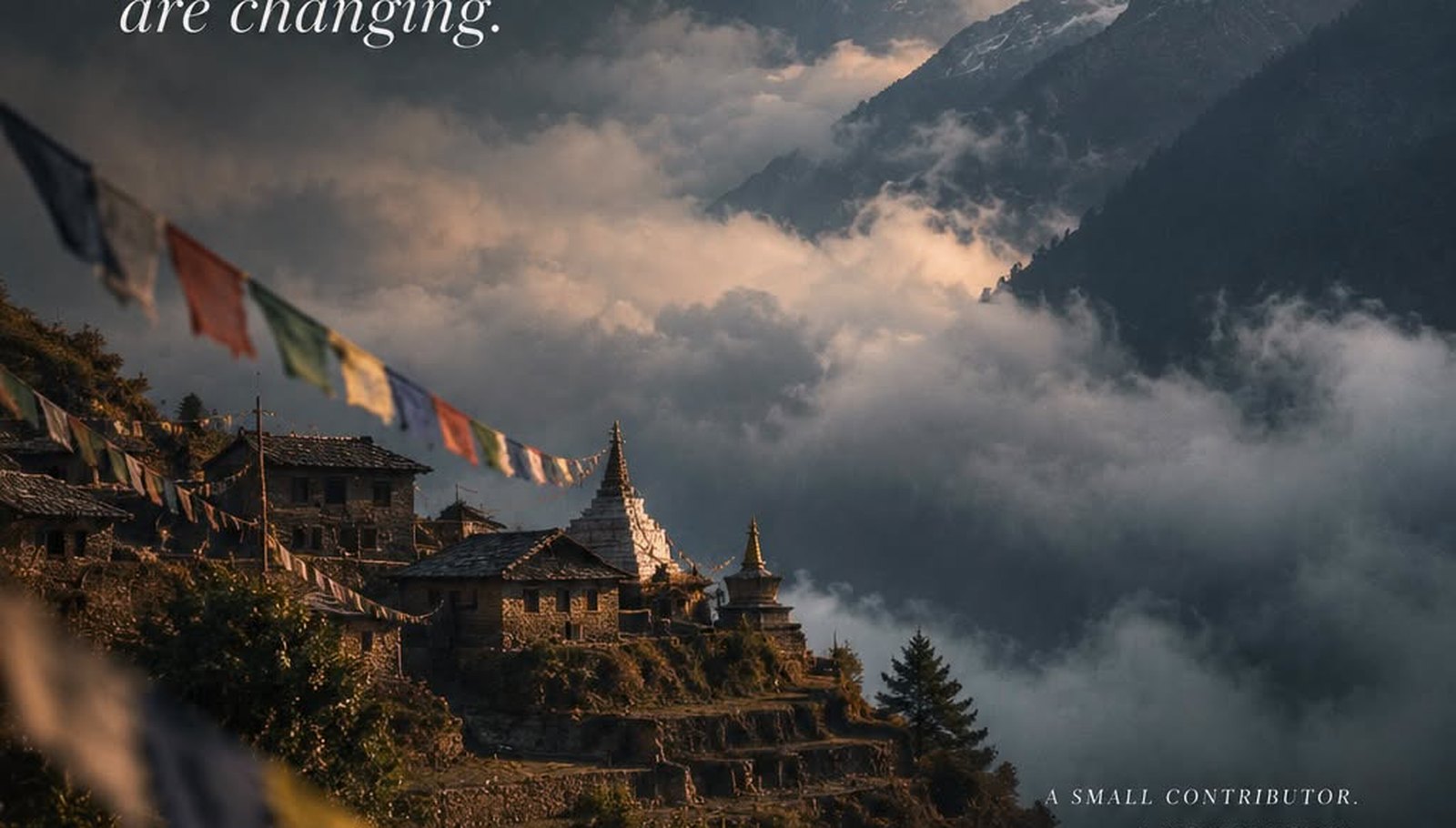 The Himalaya rising above a hill village, cloud gathering along the ridgeline.